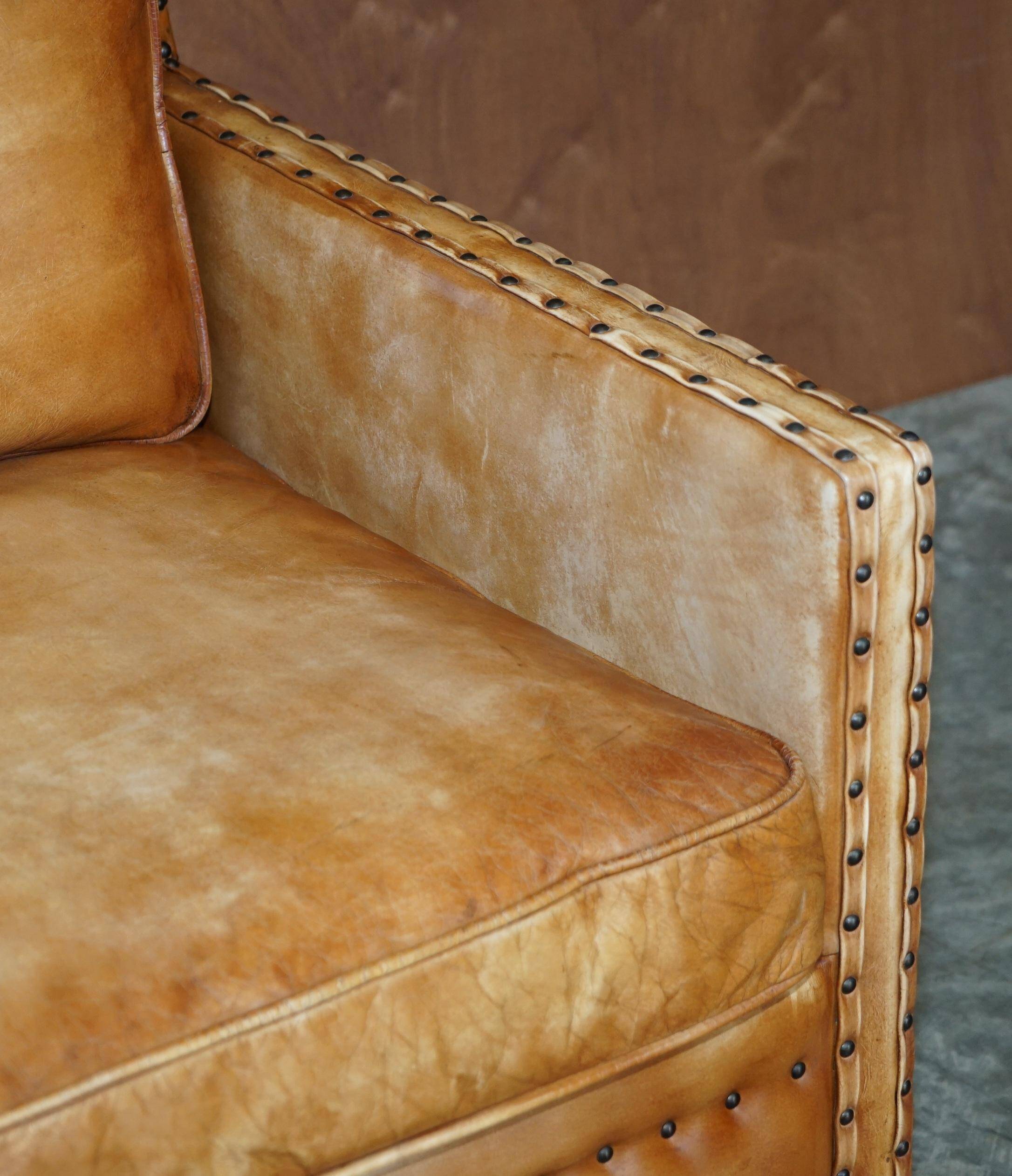Two-seater leather canapé, hand-tanned, Edwardian style with studs.