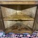 19th-century English corner cabinet in oak, mahogany, and fir.