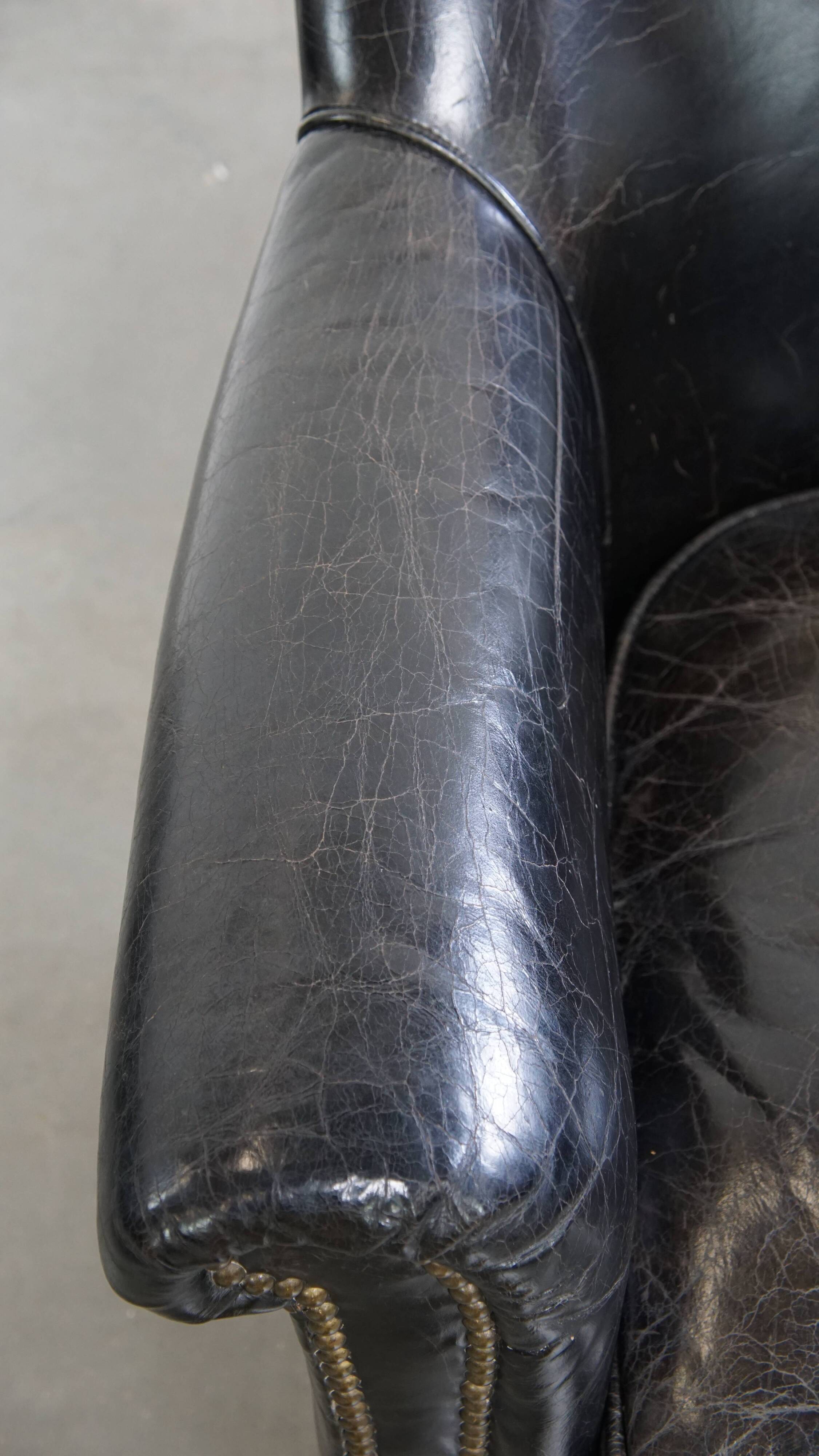 Black cowhide leather armchair