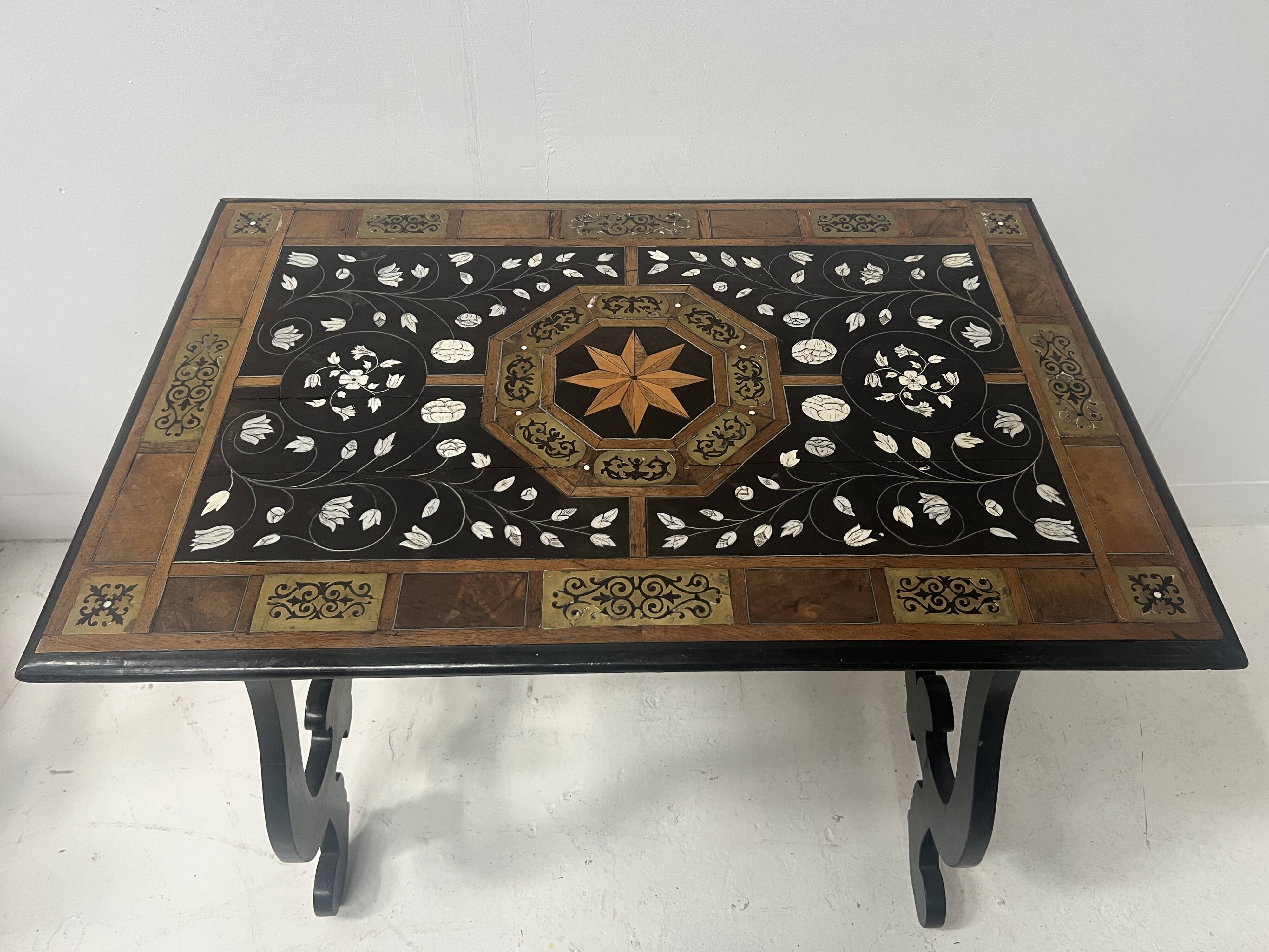 Blackened wood display table with marquetry top, Spain, 19th century.