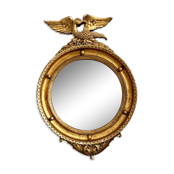 Miroir ancien doré rehaussé d’un aigle
