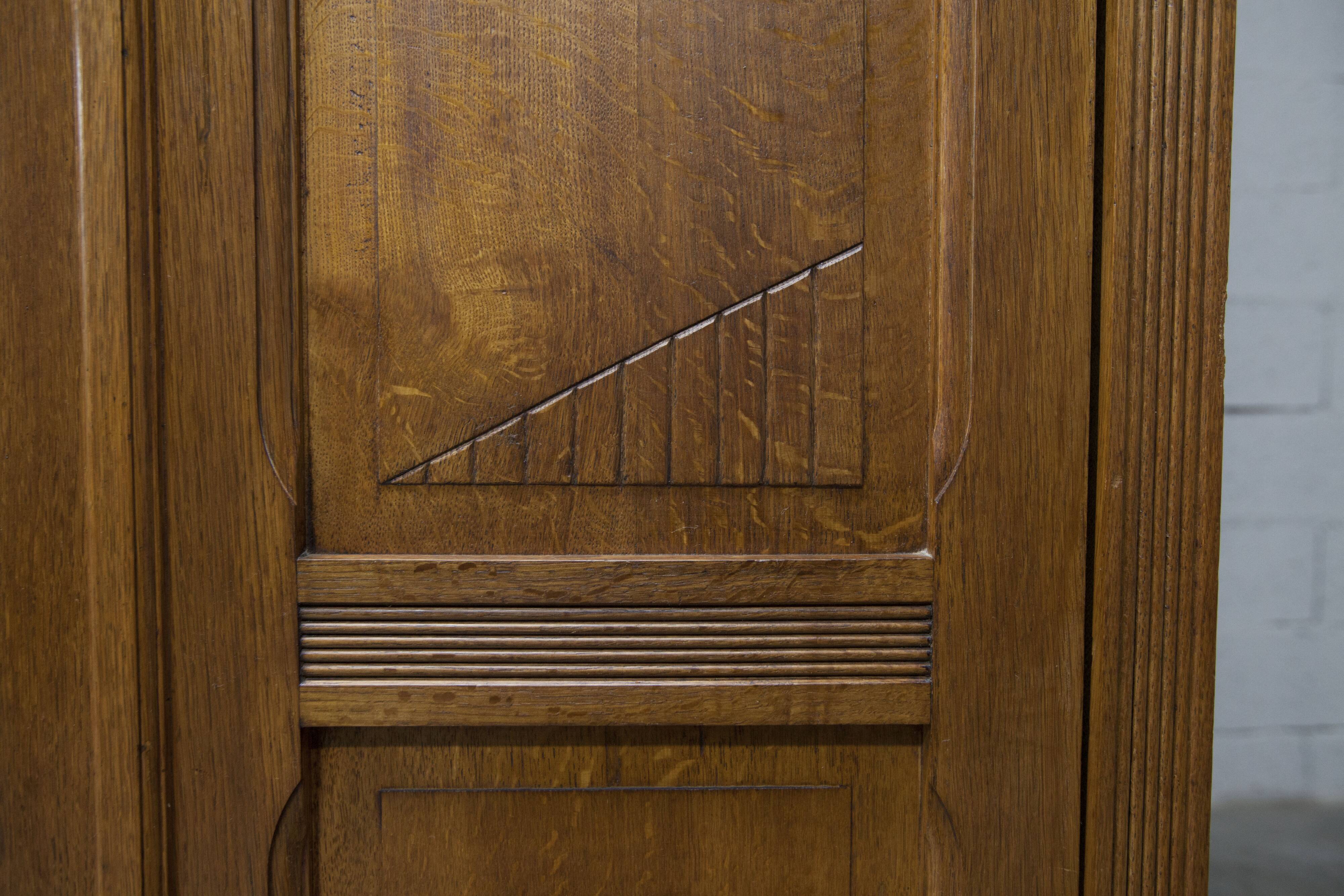 Art Deco carved oak wardrobe - Flemish workshop circa 1930