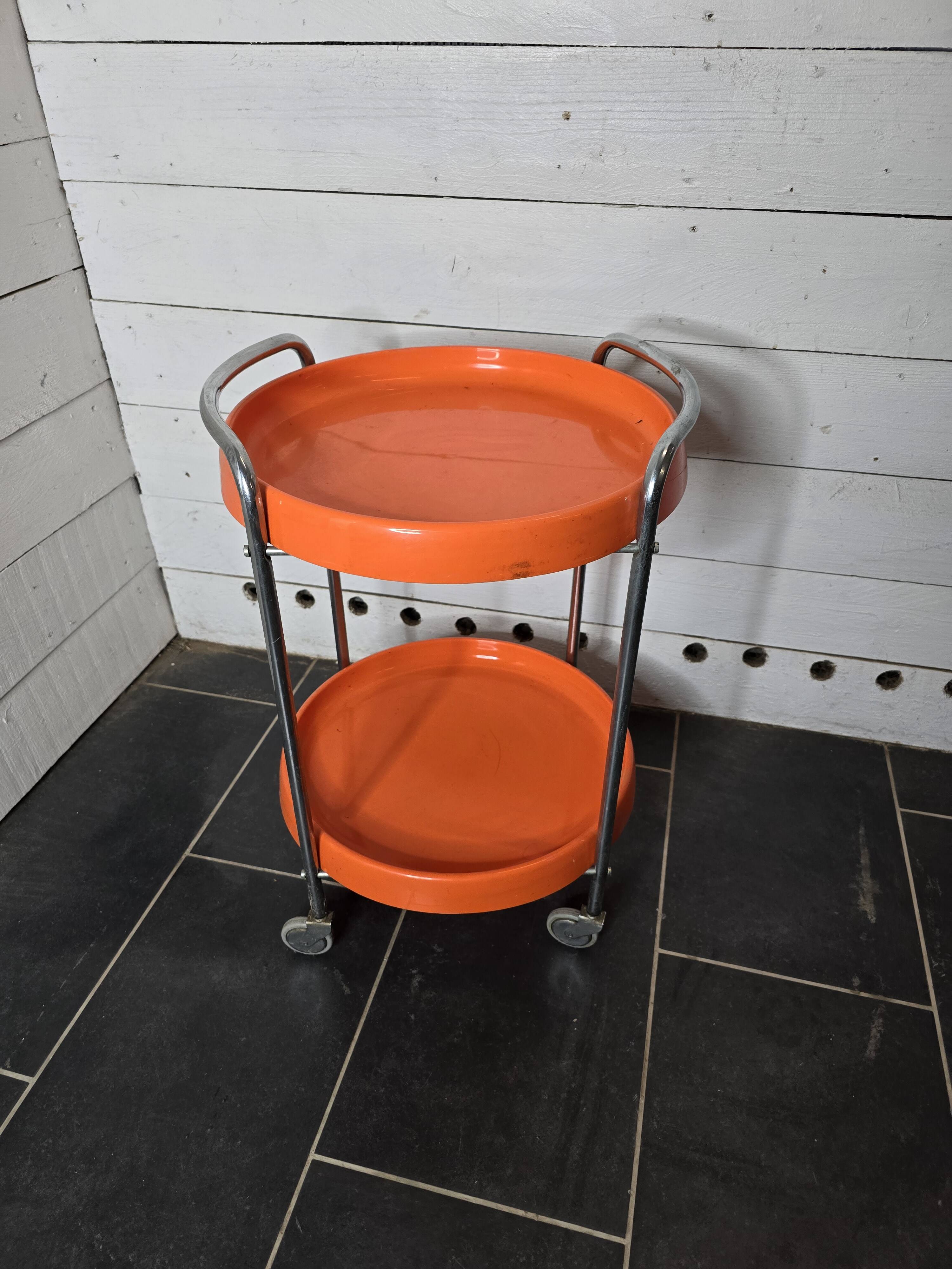 Orange trolley on wheels from the 70s