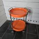 Orange trolley on wheels from the 70s