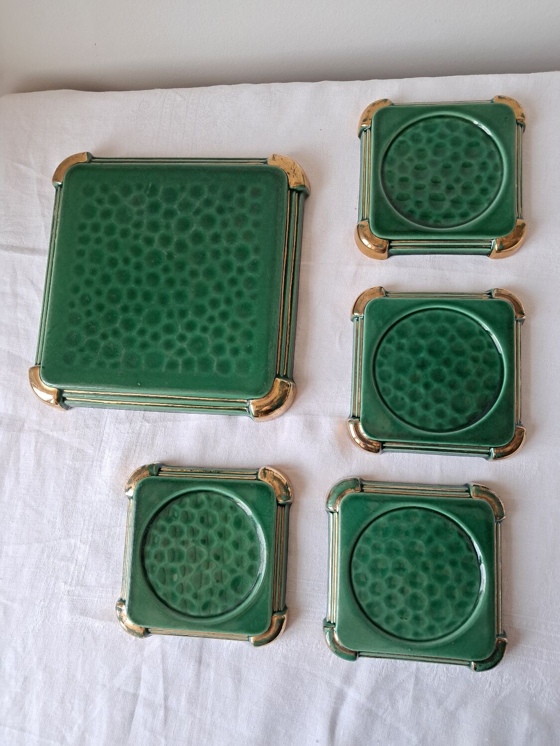 Ceramic trivets and glasses from Poët-Laval. Vintage