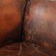 Vintage sheepskin wingback armchair in a deep brown colour finished