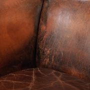 Vintage sheepskin wingback armchair in a deep brown colour finished
