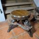 Pair of tripod stools with vine legs, oak top.