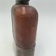 Silver-plated metal flask with leather and glass