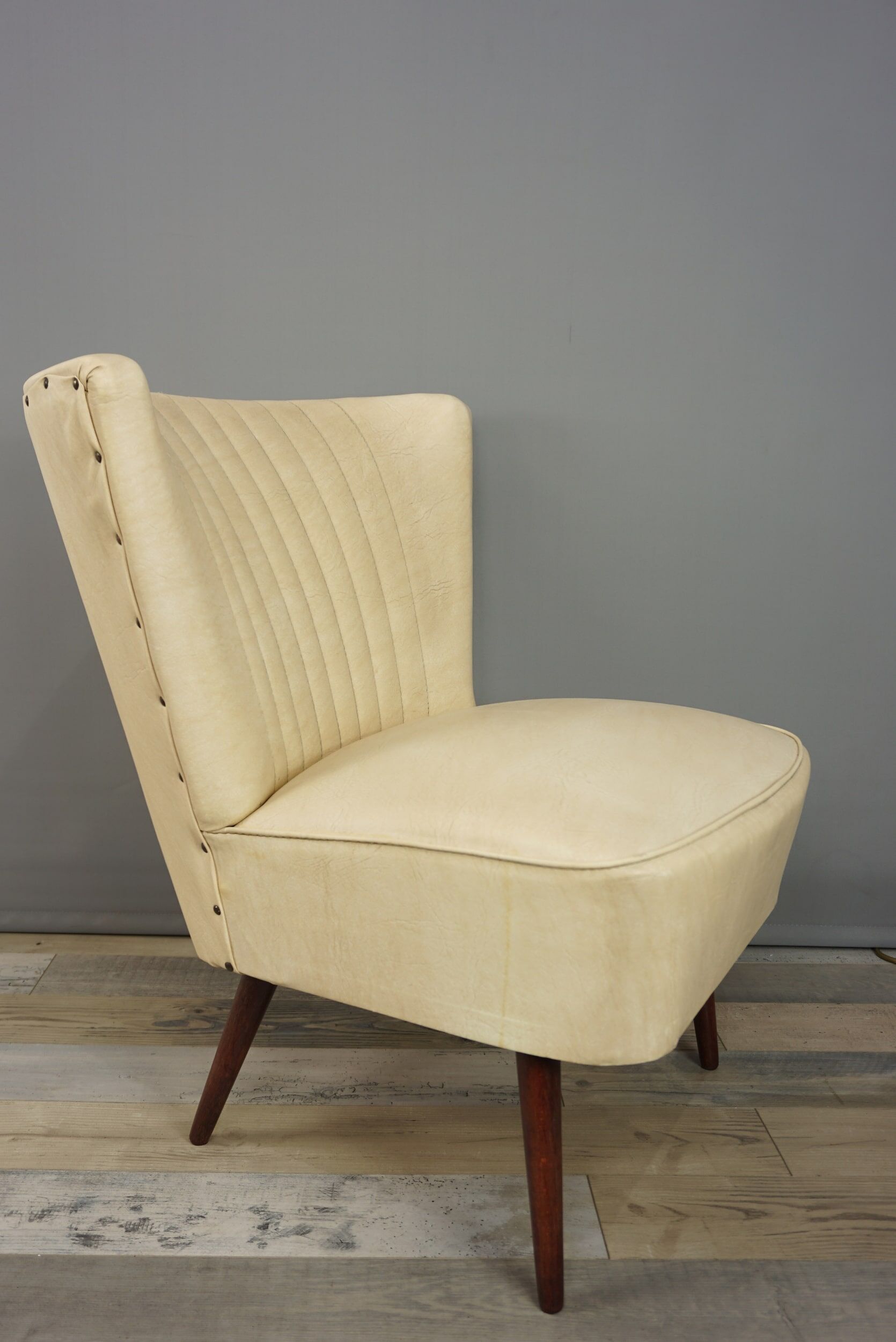 Cocktail armchair 50s in wood and imitation leather