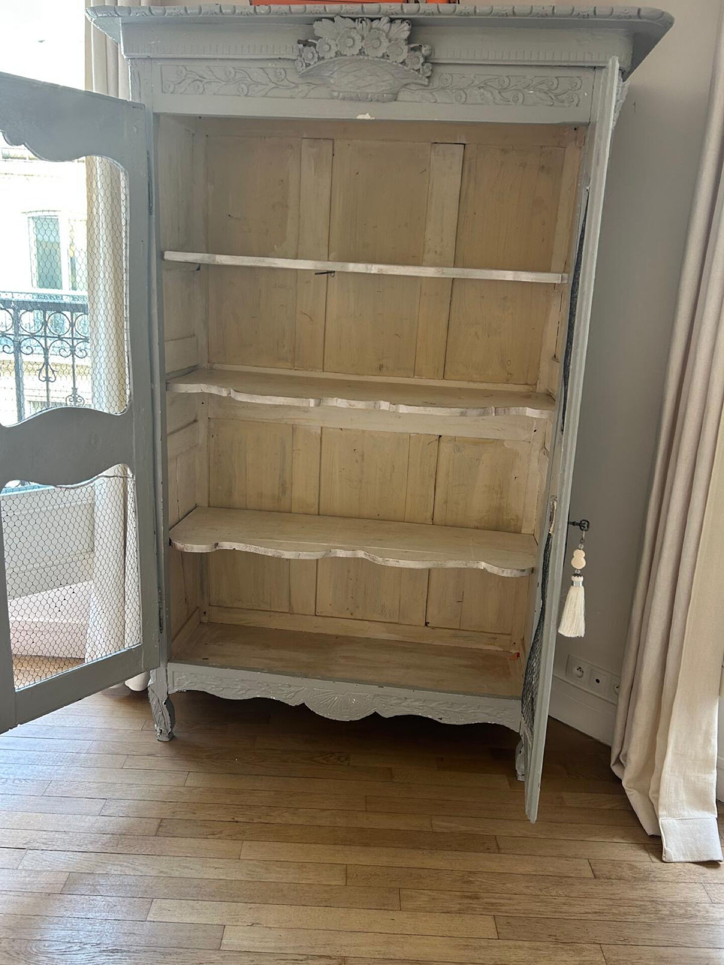 Antique French carved display cabinet with wire mesh doors