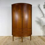 Mid-century modern corner furniture in teak with doors.