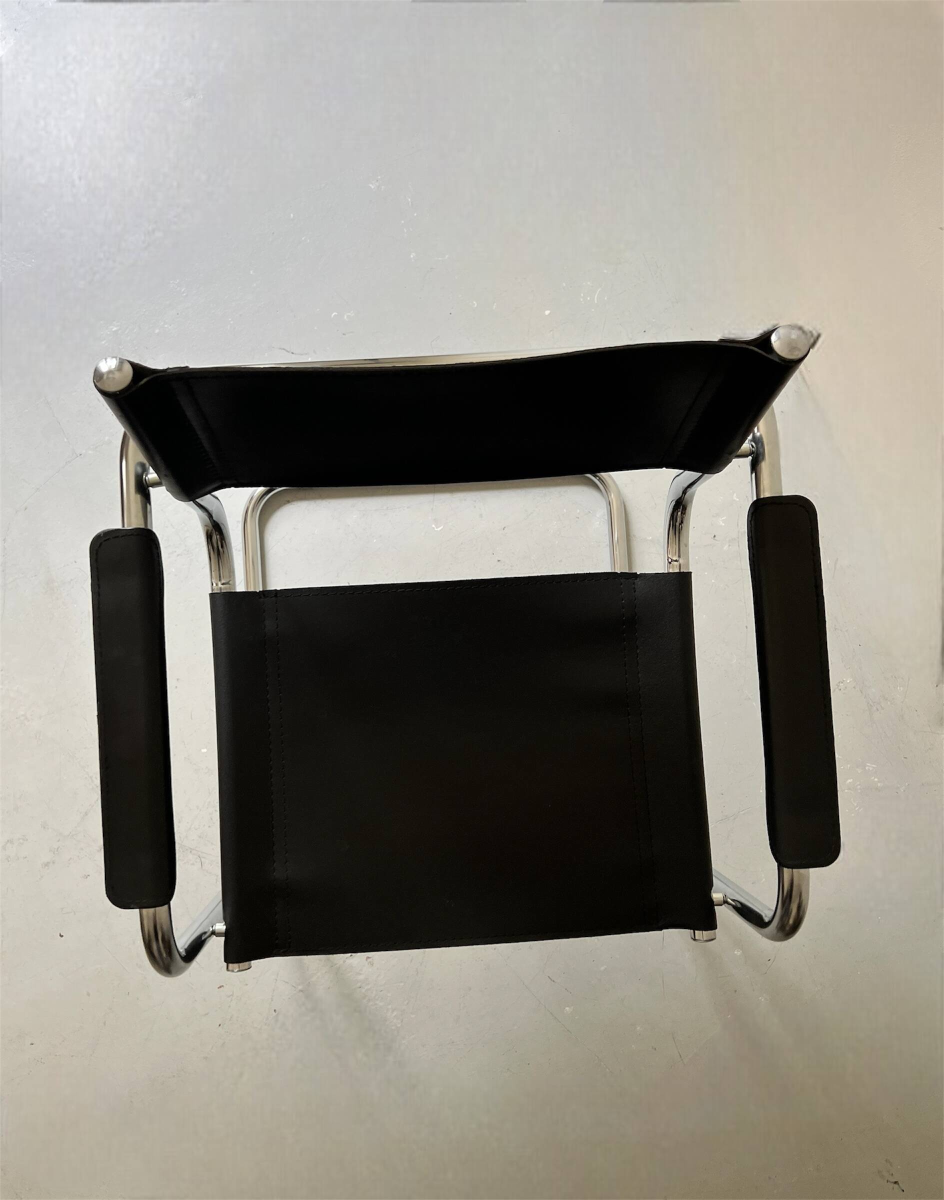 Chrome and black leather armchair