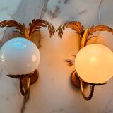 Pair of palm leaf wall lights in Hollywood Regency style with opaque globes by Hans Kögl, Germany, 1970s.