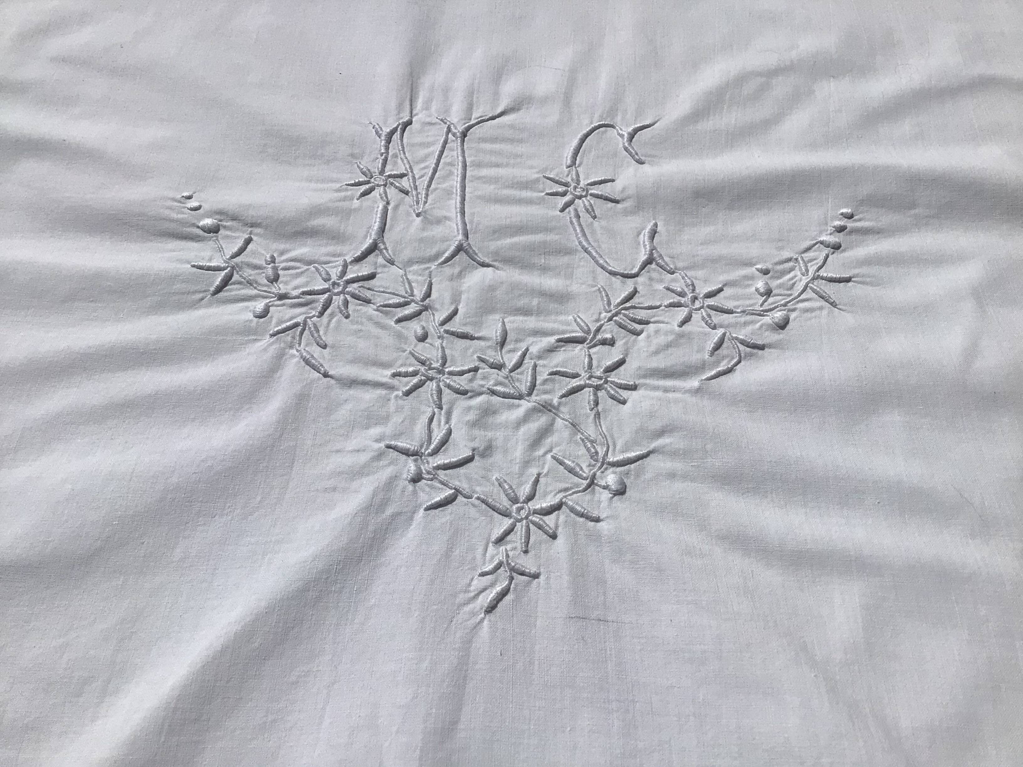 MC embroidered pillowcase with flower detailing and crocheted edge