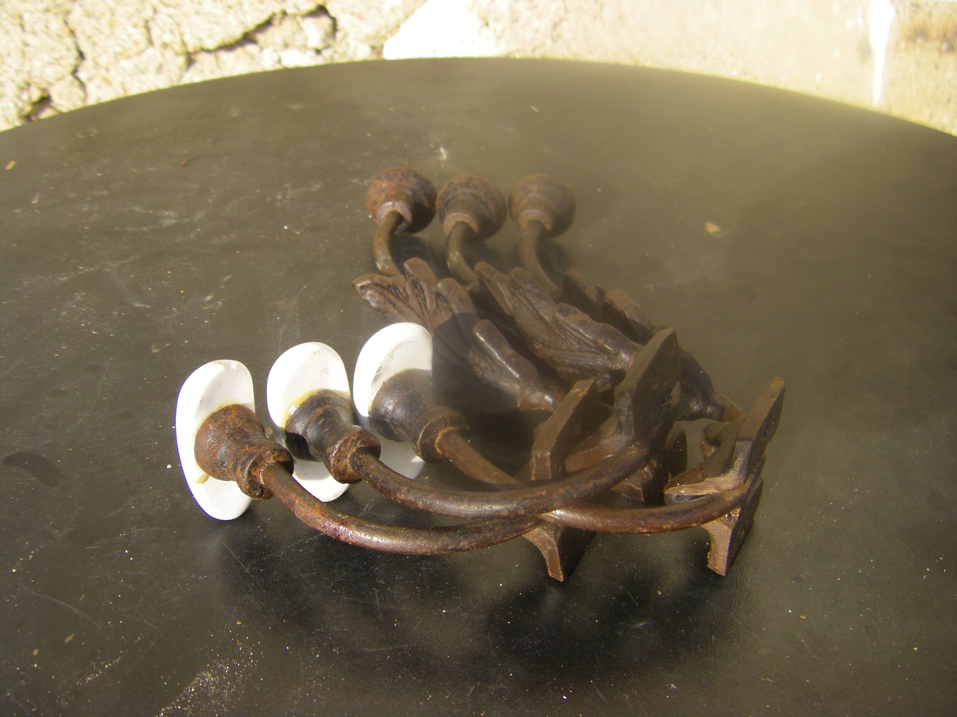 Trio of vintage coat hooks.