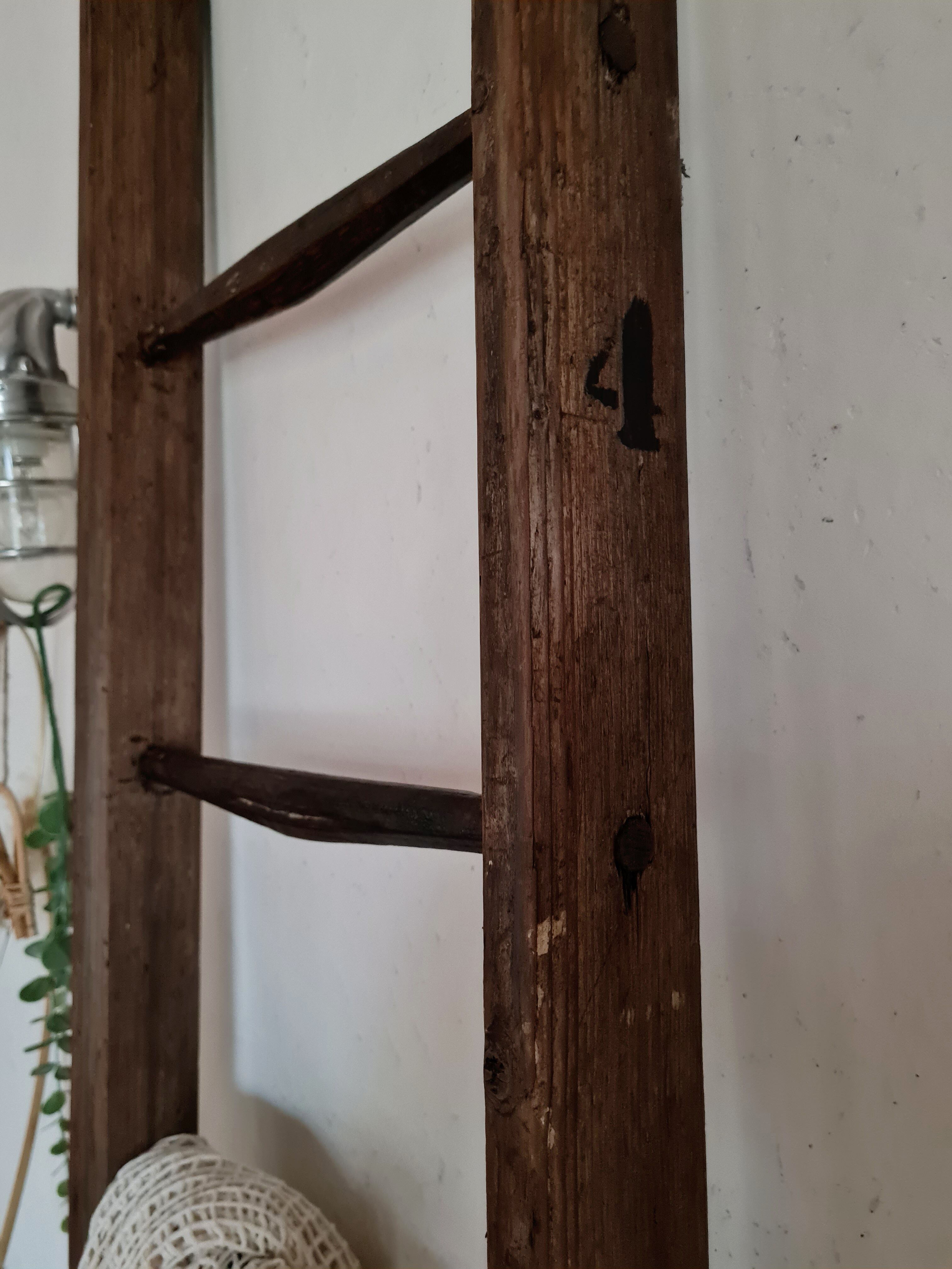 Old wooden farm ladder