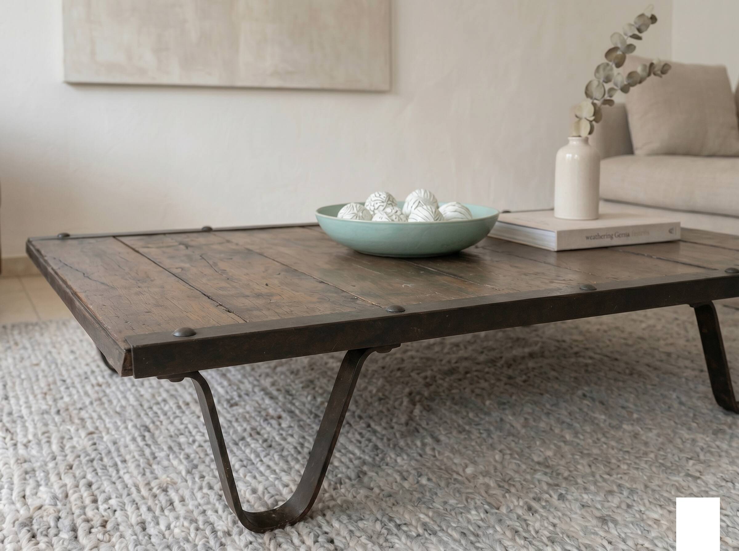 Industrial coffee table made of solid wood and old railway tracks.