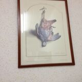 Table with poster "The Red Partridge"