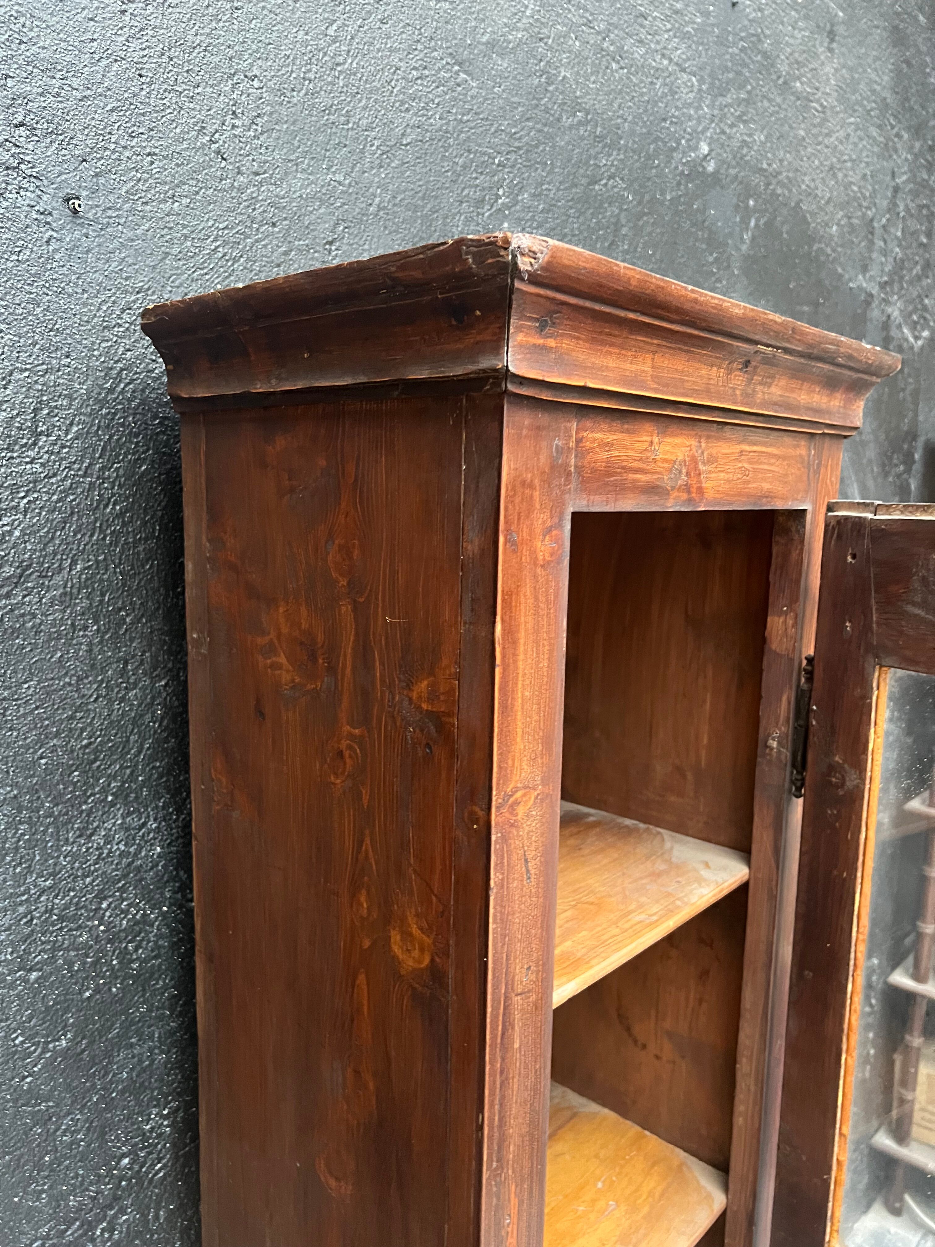 Old narrow wooden showcase.