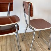 Trio of chairs in light brown formica and cream contour 70s