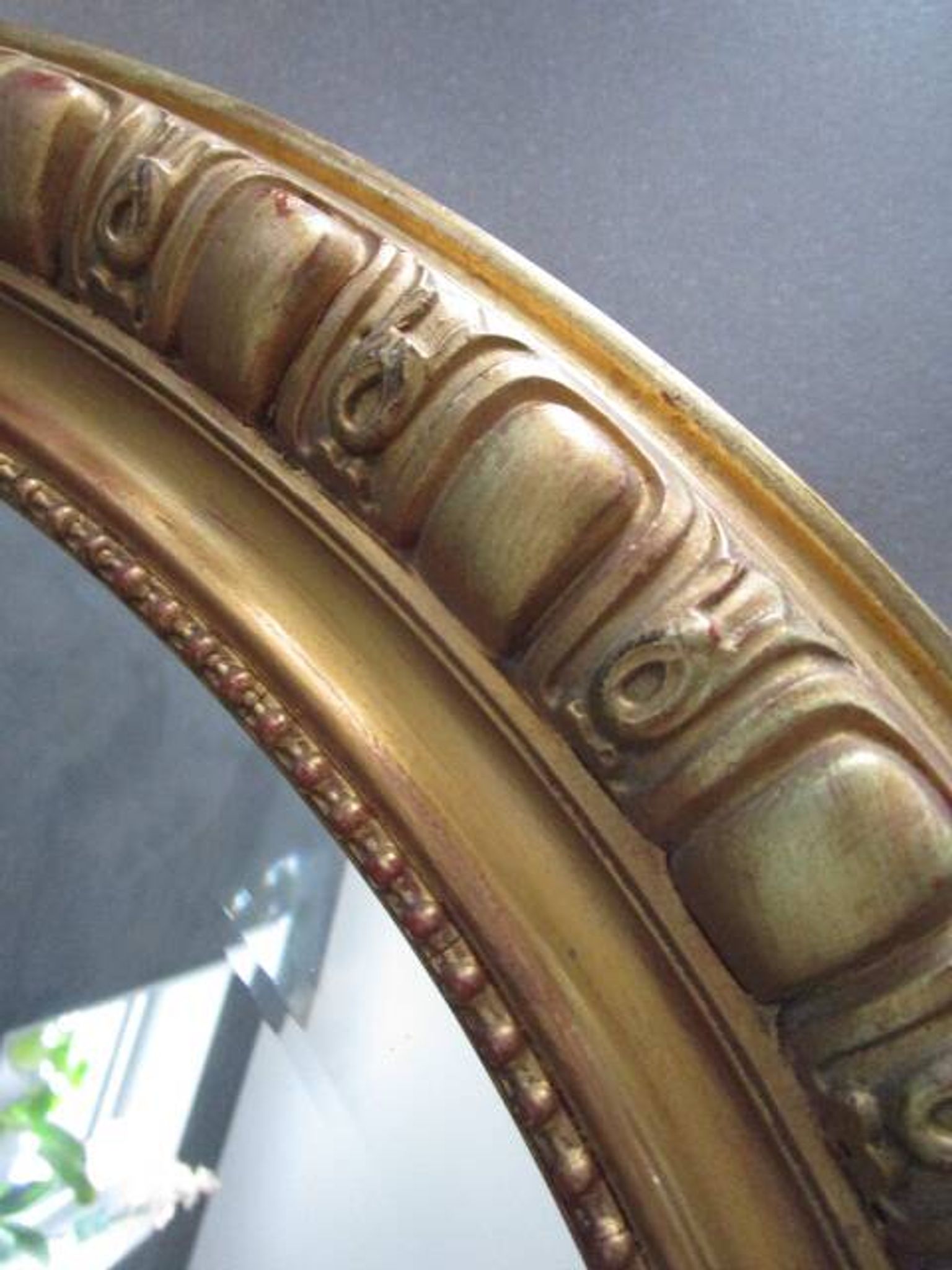 Antique mirror in wood and gilded stucco