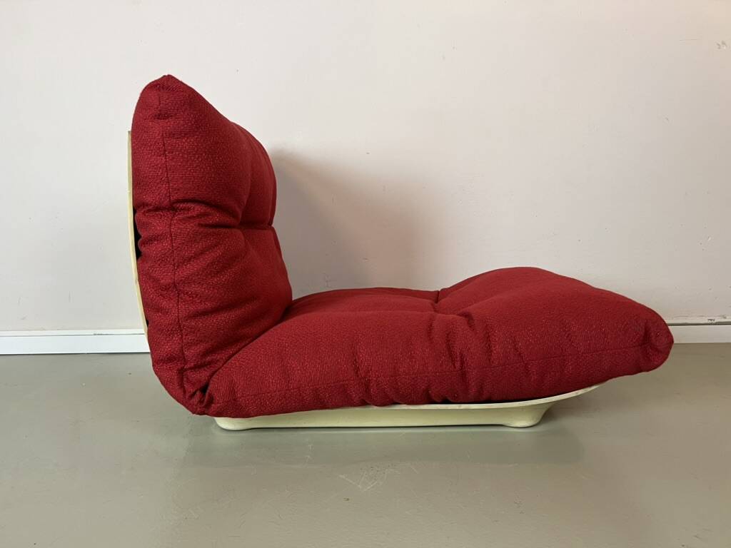 Vintage red shell lounge chairs from the 70s mid-century retro.