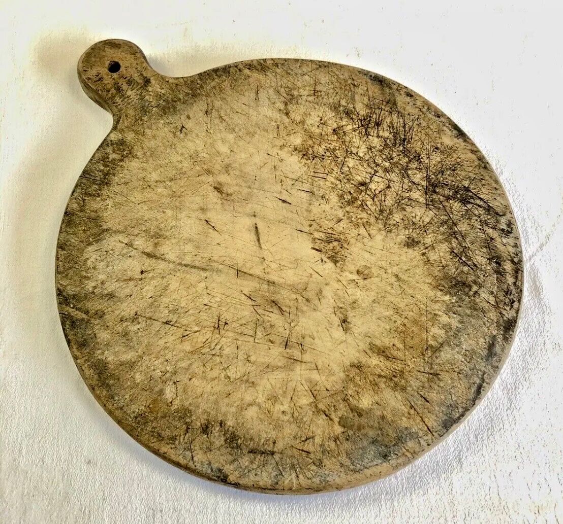 Old large round pizza cutting board