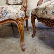Pair of Louis XV style armchairs - In carved and moulded wood with flowers