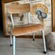 Old wooden and metal children's school chair