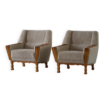 Modern Danish, pair of armchairs in oak and lambswool, Henning Kjærnulf, 1960s.