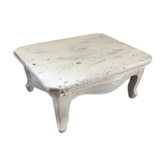 Former foot, skated in white wooden rest