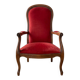 Antique armchair in carved wood and red fabric.
