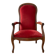 Antique armchair in carved wood and red fabric.
