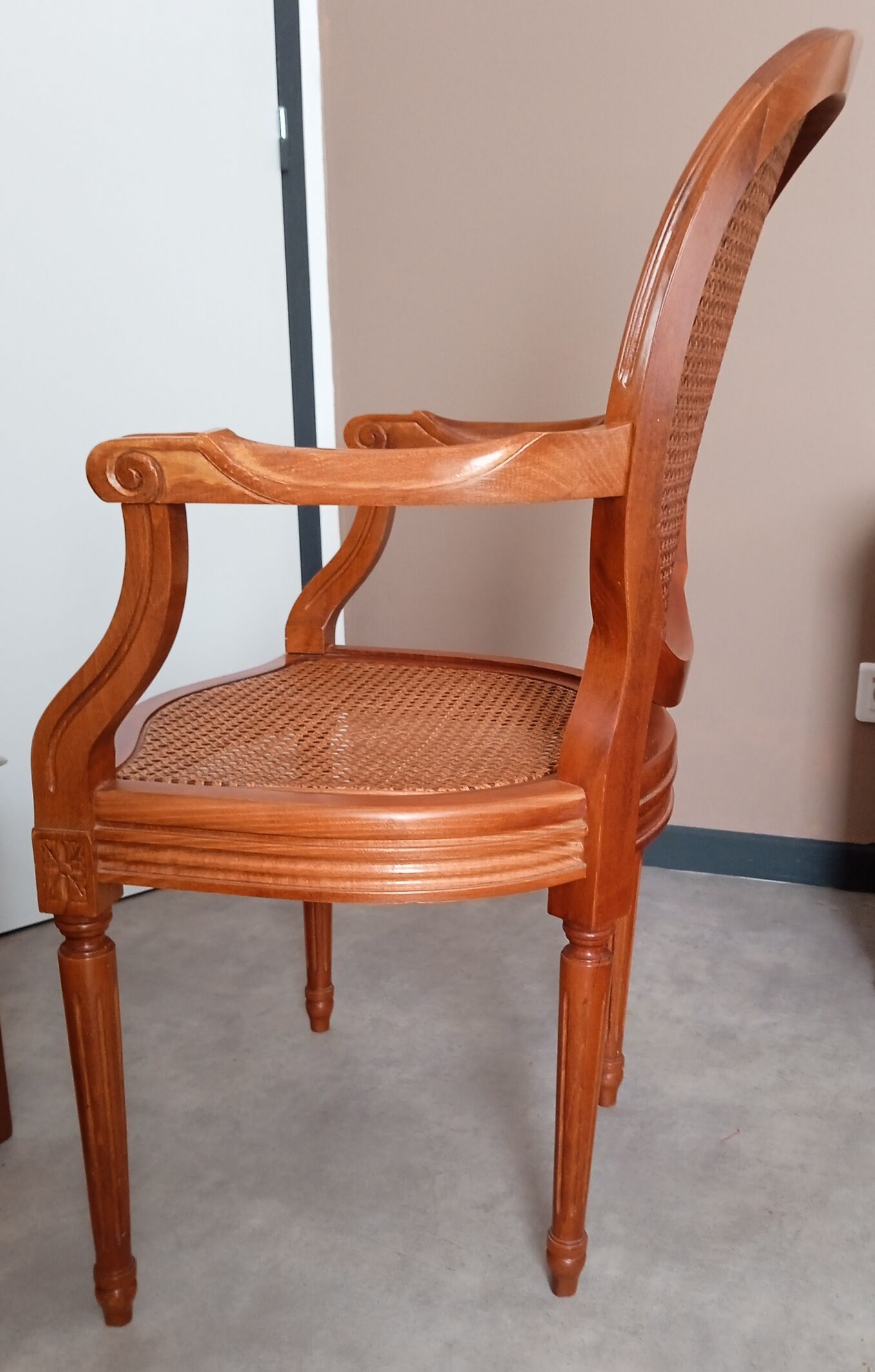 Antique Louis XVI style cane armchair
