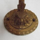 French Art Nouveau wall sconce in bronze with a white and pink glass shade.