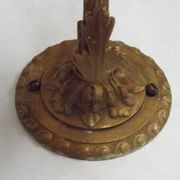 French Art Nouveau wall sconce in bronze with a white and pink glass shade.