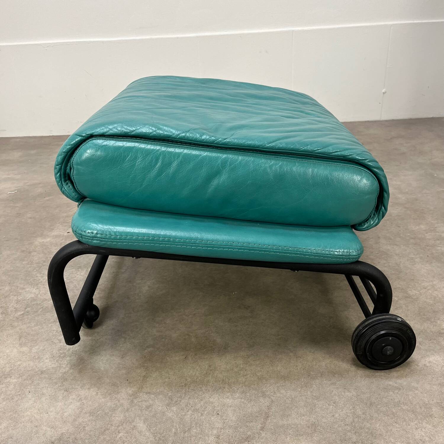 Postmodern design armchair and ottoman, 80s leather
