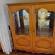 Showcase with shell mouldings in wood, glass, and mirror.
