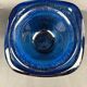 Mortar and pestle in the style of Biot, hard blue.