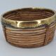 Cache-pot en rotin cerclé de laiton vers 1960 DLG Gabriella Crespi