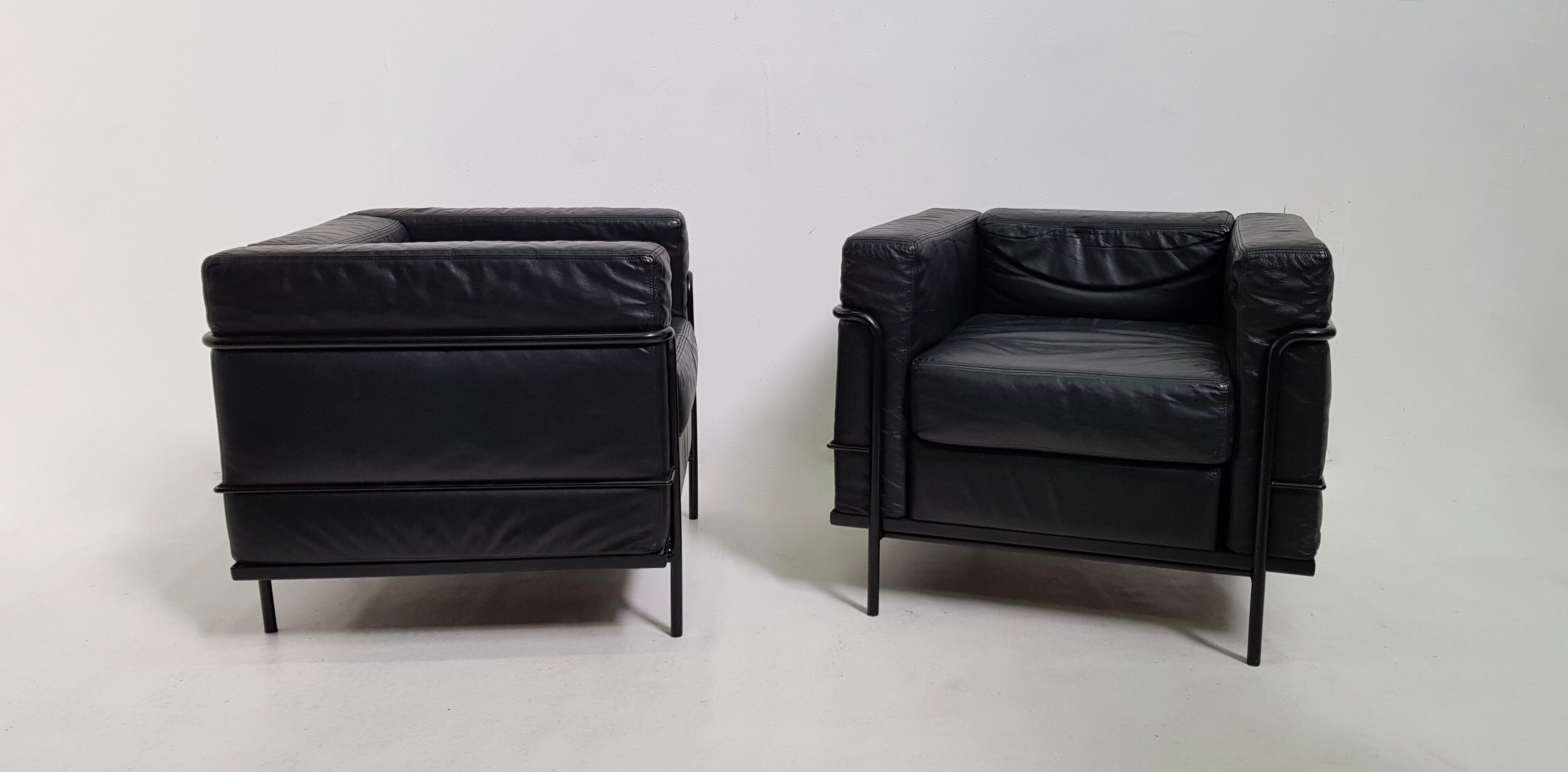 Pair of vintage armchairs Hugues Chevalier in leather 1980
