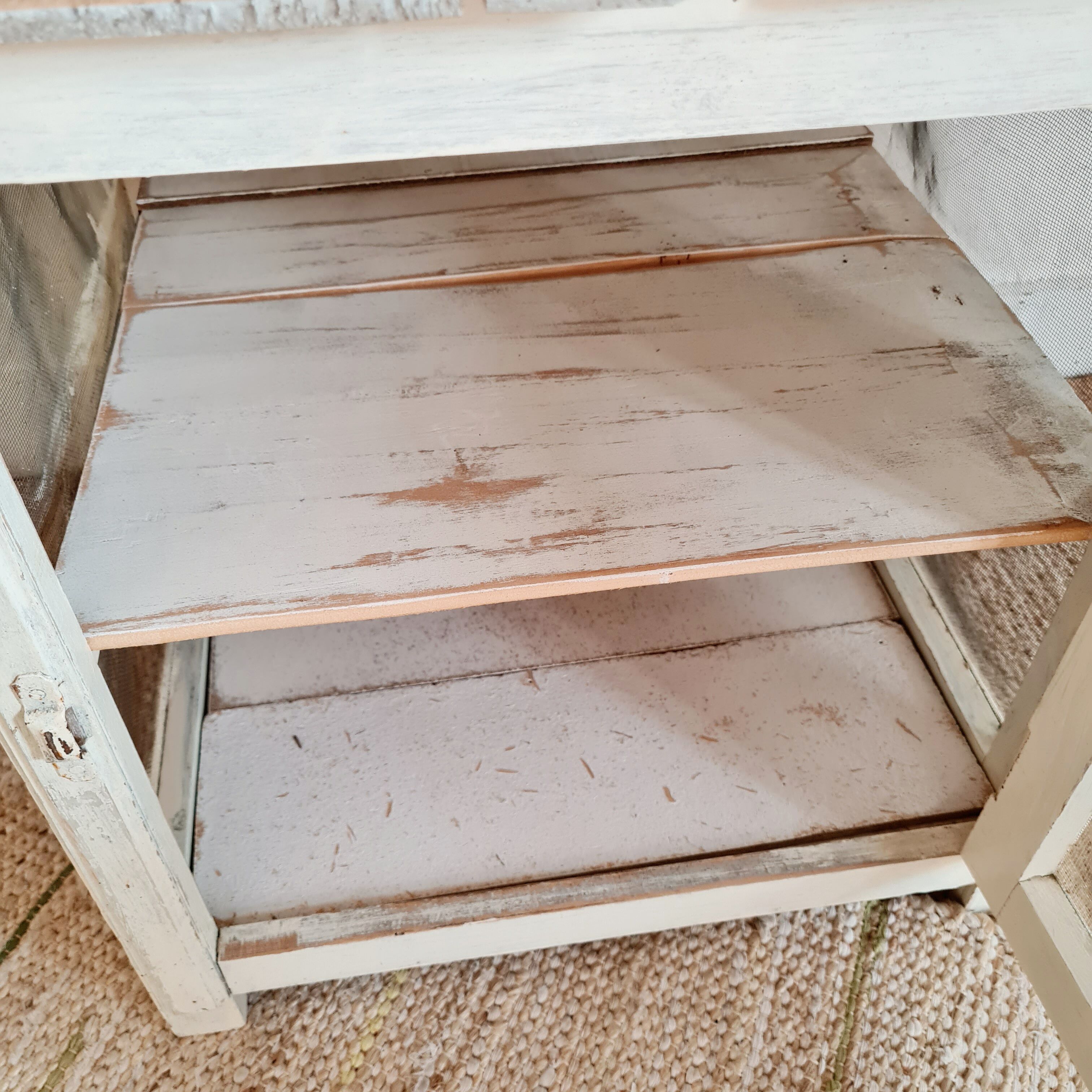 Wooden pantry and white mesh