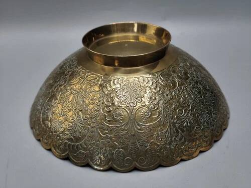 Engraved brass bowl from the mid-20th century with a scalloped edge.