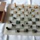 Onyx chessboard and complete wooden chess set.