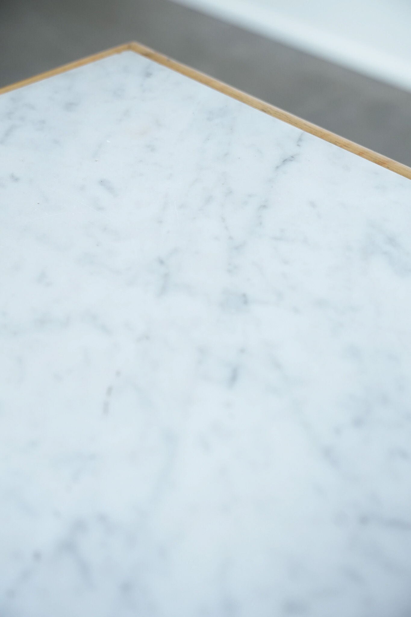 Antique wooden 1-door hallway/nightstand with a light marble top