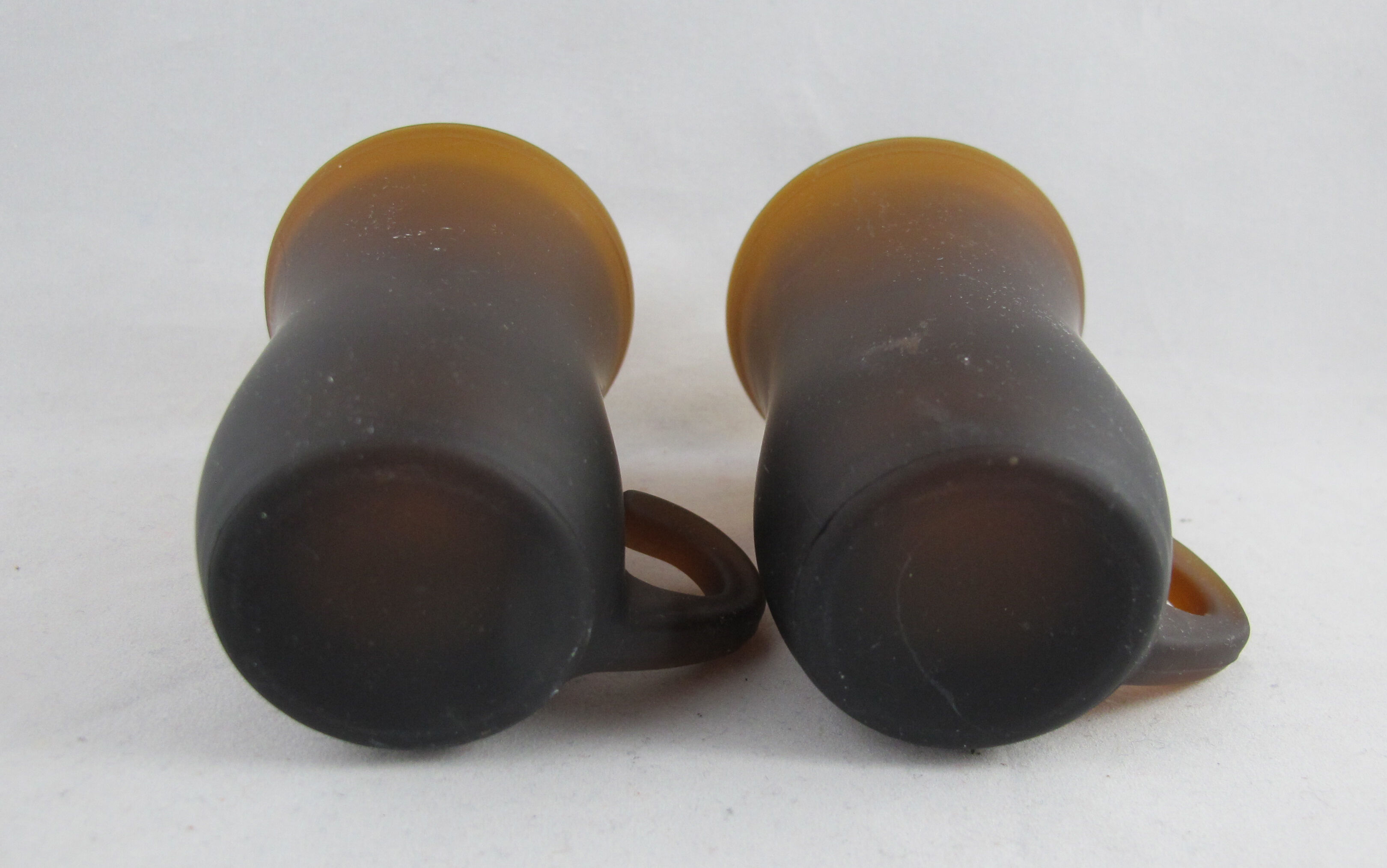 pair of small brown glass cups