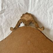 Ancien miroir mural biseauté en bois massif doré