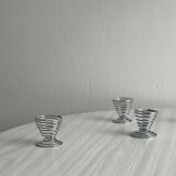 Set of 4 designer egg cups in shiny silver metal