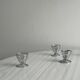 Set of 4 designer egg cups in shiny silver metal